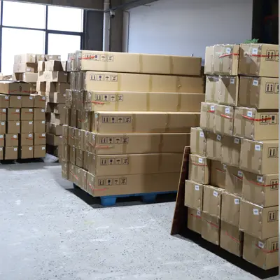 Artificial plants packaged in carton boxes.