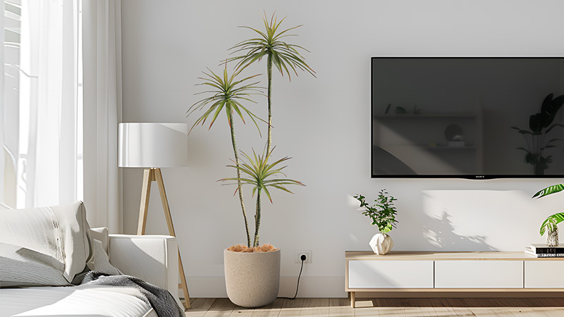 Tall artificial tree in a beige pot, stylish addition to modern living room interiors.