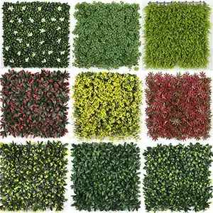 Assorted artificial hedge panels in various colors and leaf designs.