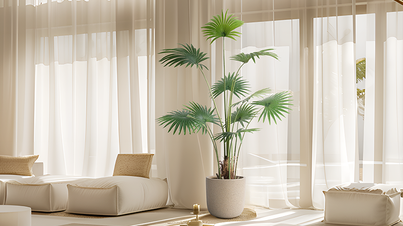 Artificial palm tree in a modern room with beige curtains and soft seating, perfect for decoration and landscaping.