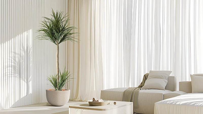 Potted palm tree decor Artificial potted palm tree in a minimalist living room with soft natural lighting.