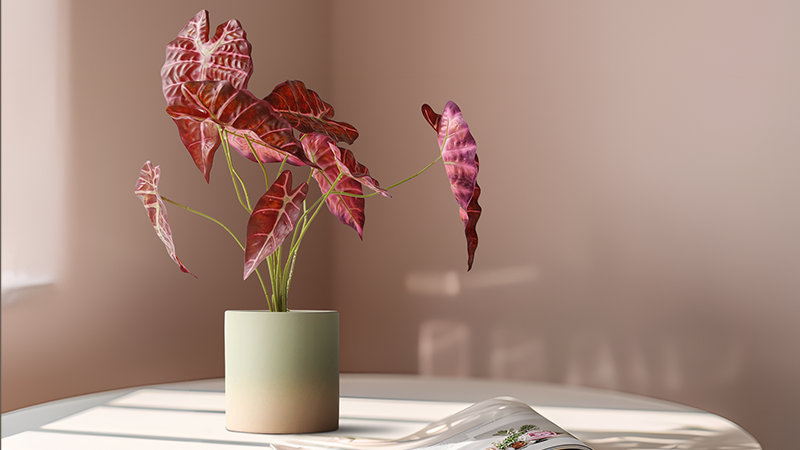 Artificial red-leaf plant in a minimalist pot, elegant tabletop decor for modern interiors.