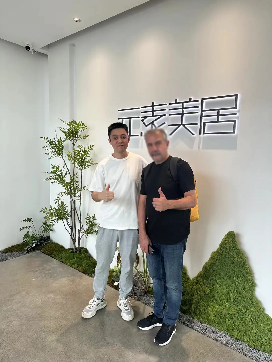 Two Men Posing Indoors