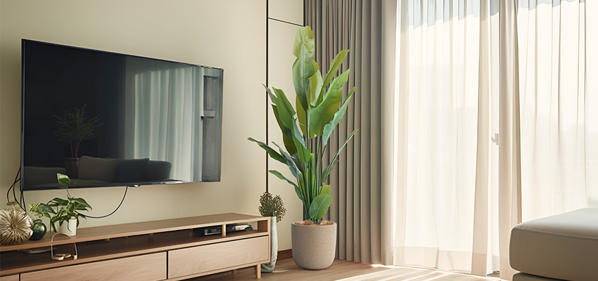 Artificial Bird of Paradise Plant Artificial bird of paradise plant in a modern living room, placed in a minimalist beige pot.