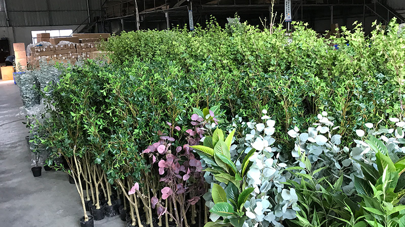 Artificial plant stock Artificial plant warehouse, green foliage, bulk storage