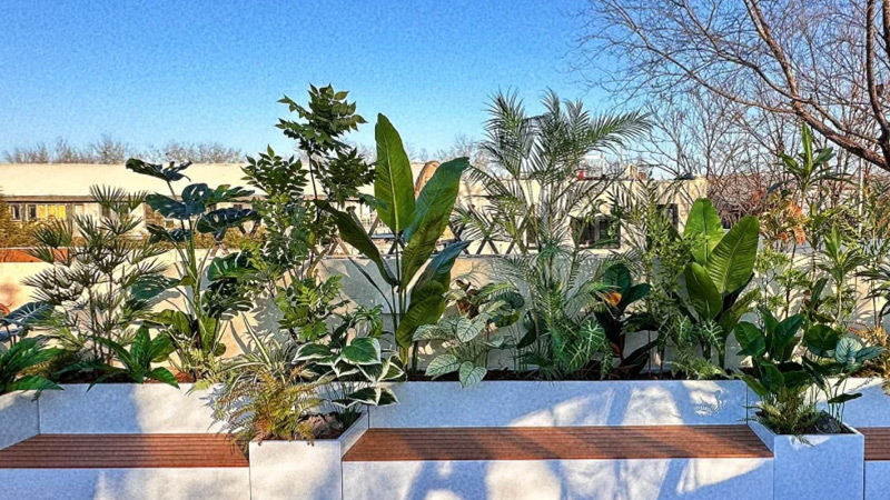 Outdoor artificial plants Outdoor artificial plant arrangement, modern planter boxes with lush green artificial foliage