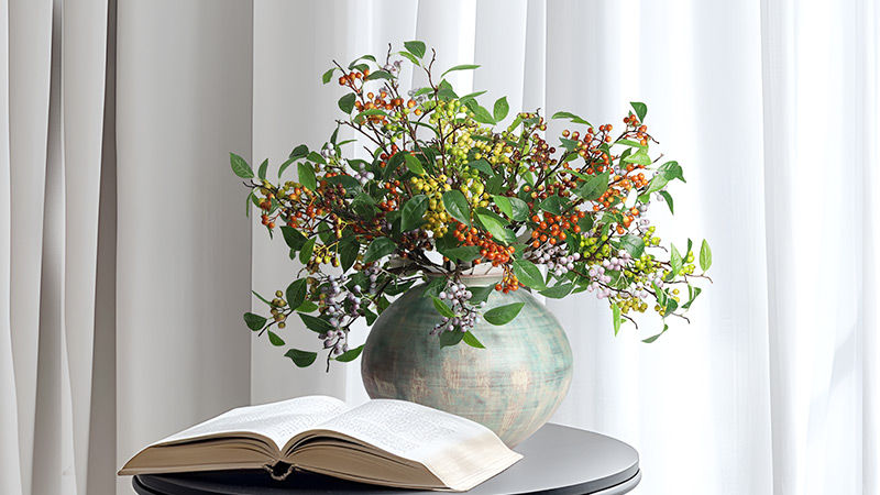 colorful berry flowers in a vase on a table, white background