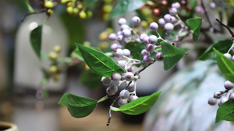 faux berry arrangement purple berries and green leaves in a vase, home decor