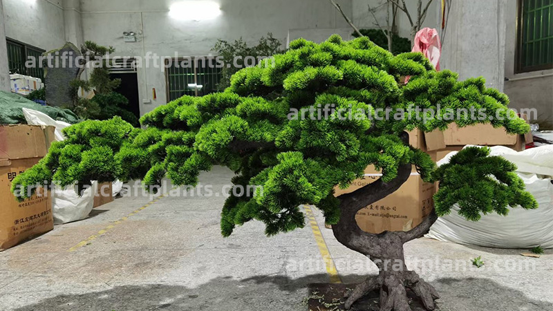 fake pine tree for sale large artificial pine tree in a factory setting
