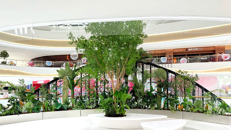 Artificial Atrium Plants large artificial tree and plants in a modern shopping mall atrium