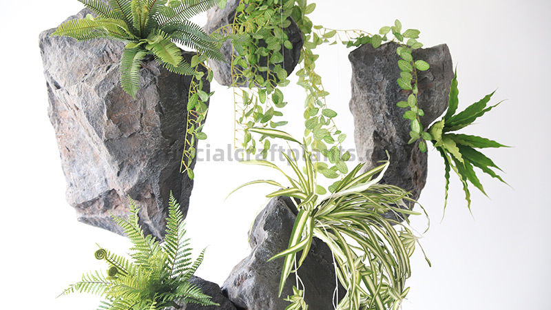 Artificial Floating Plants Decor Artificial hanging plants and ferns on faux floating rock structures.