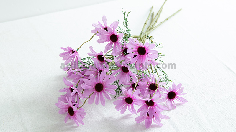 Artificial Purple Daisies bunch of artificial purple daisy flowers on a white surface