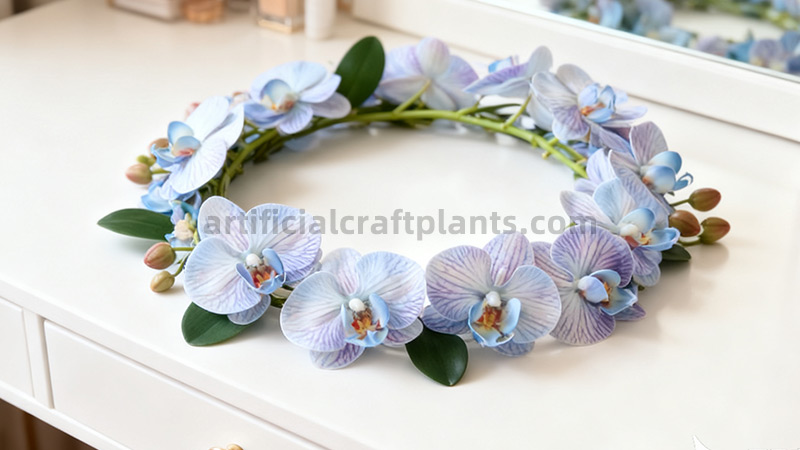 Artificial blue orchid crown Realistic artificial blue orchid flower crown on a white dresser