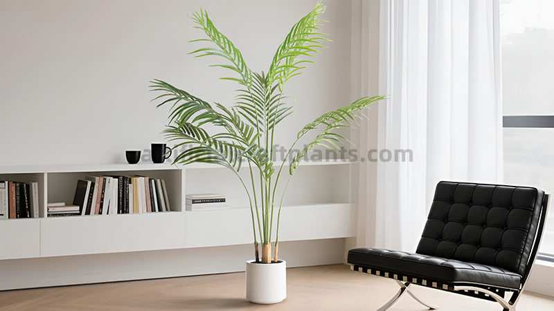 Lush indoor display of mixed artificial tropical foliage and ferns