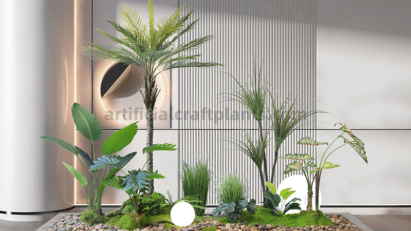 Indoor Artificial Plant Display Indoor artificial plant display with a variety of green plants, moss, and river stones.