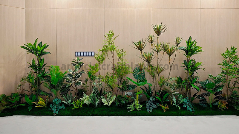 Indoor Artificial Plantscape Large indoor artificial plant landscape with assorted greenery and moss base.