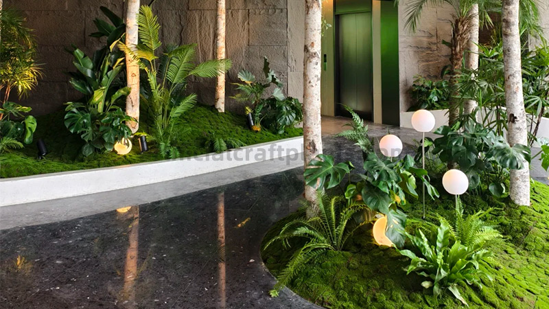 Lobby Artificial Garden Indoor artificial garden with moss, birch trees, and various plants in a modern lobby.