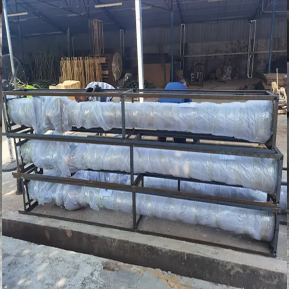 large artificial tree trunks wrapped for protective export packing