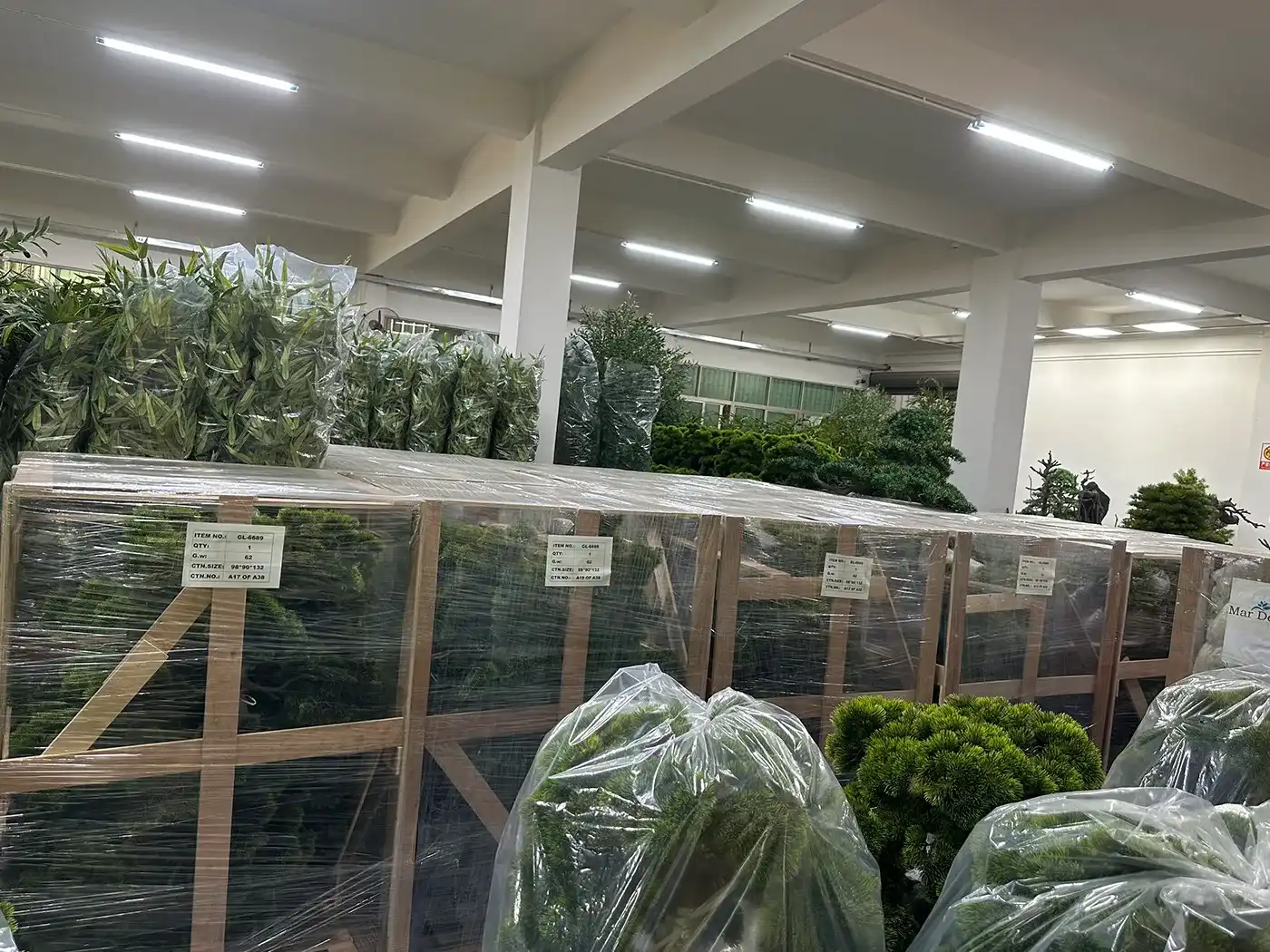 Packed modular artificial tree components prepared for export shipment